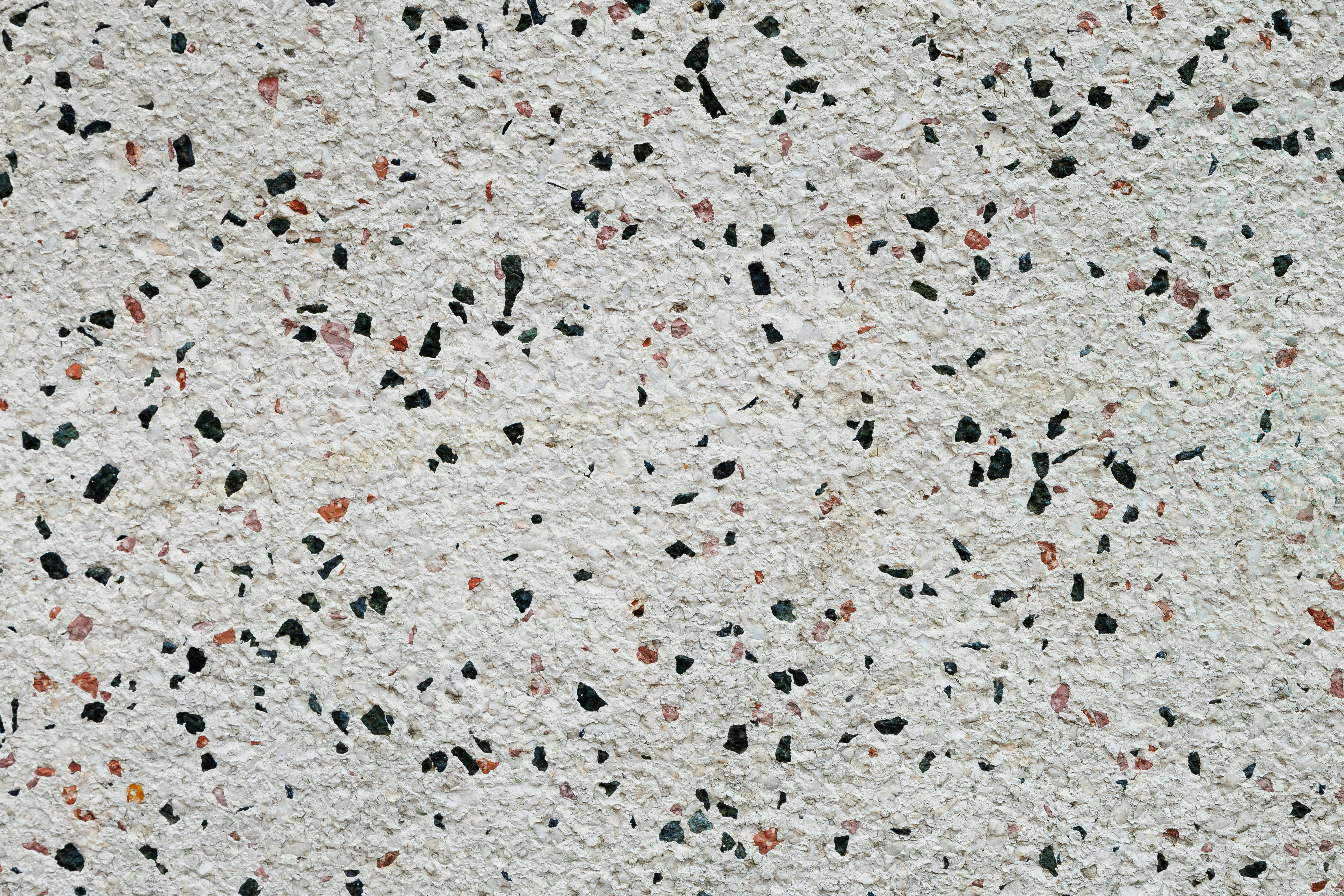 Gratis Imagen detallada de una superficie de terrazo que muestra fragmentos de piedra multicolores. Foto de stock