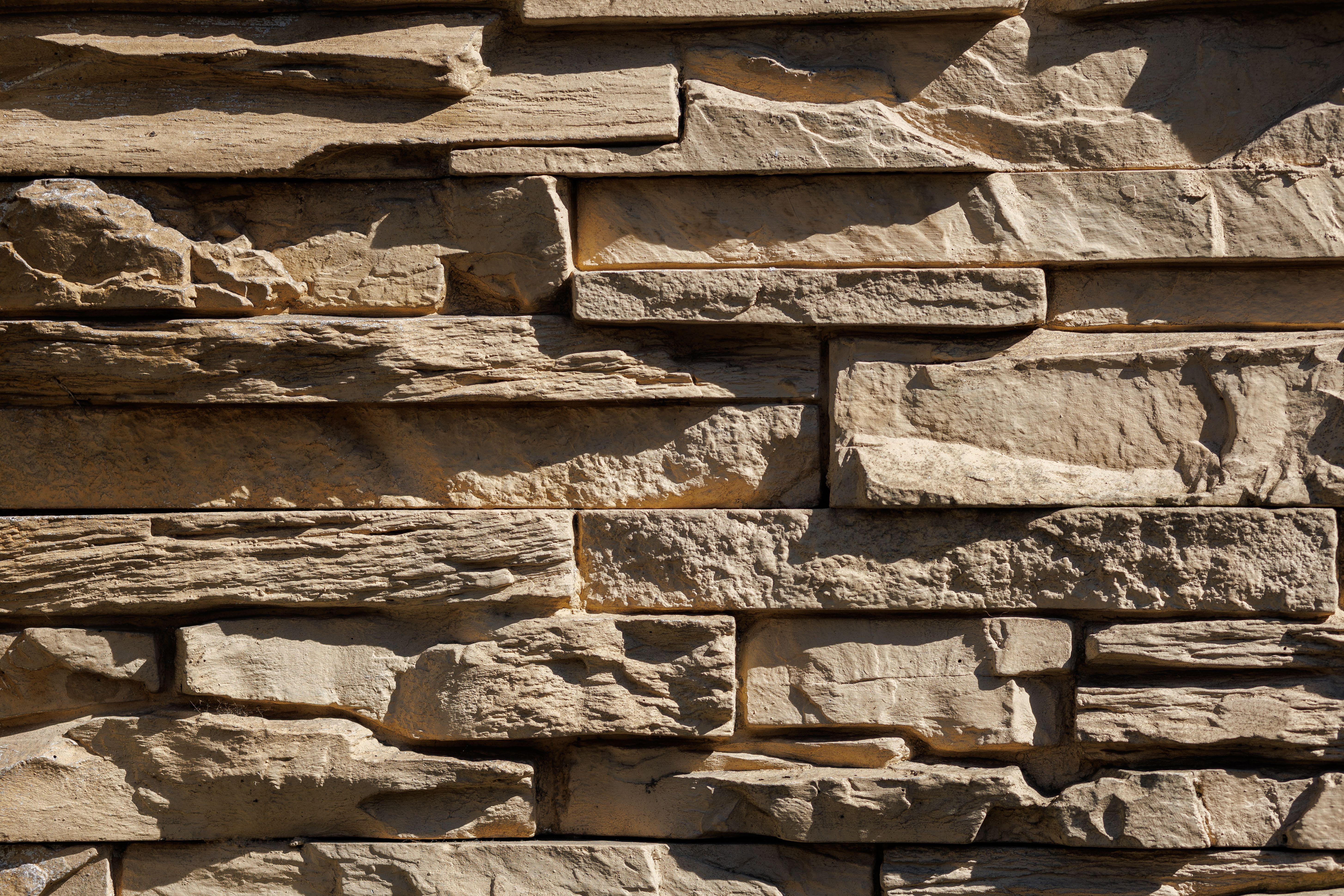 Rustic Stone Wall with Textured Surface · Free Stock Photo