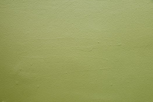 Close-up of a green textured wall, perfect for backgrounds and design projects.