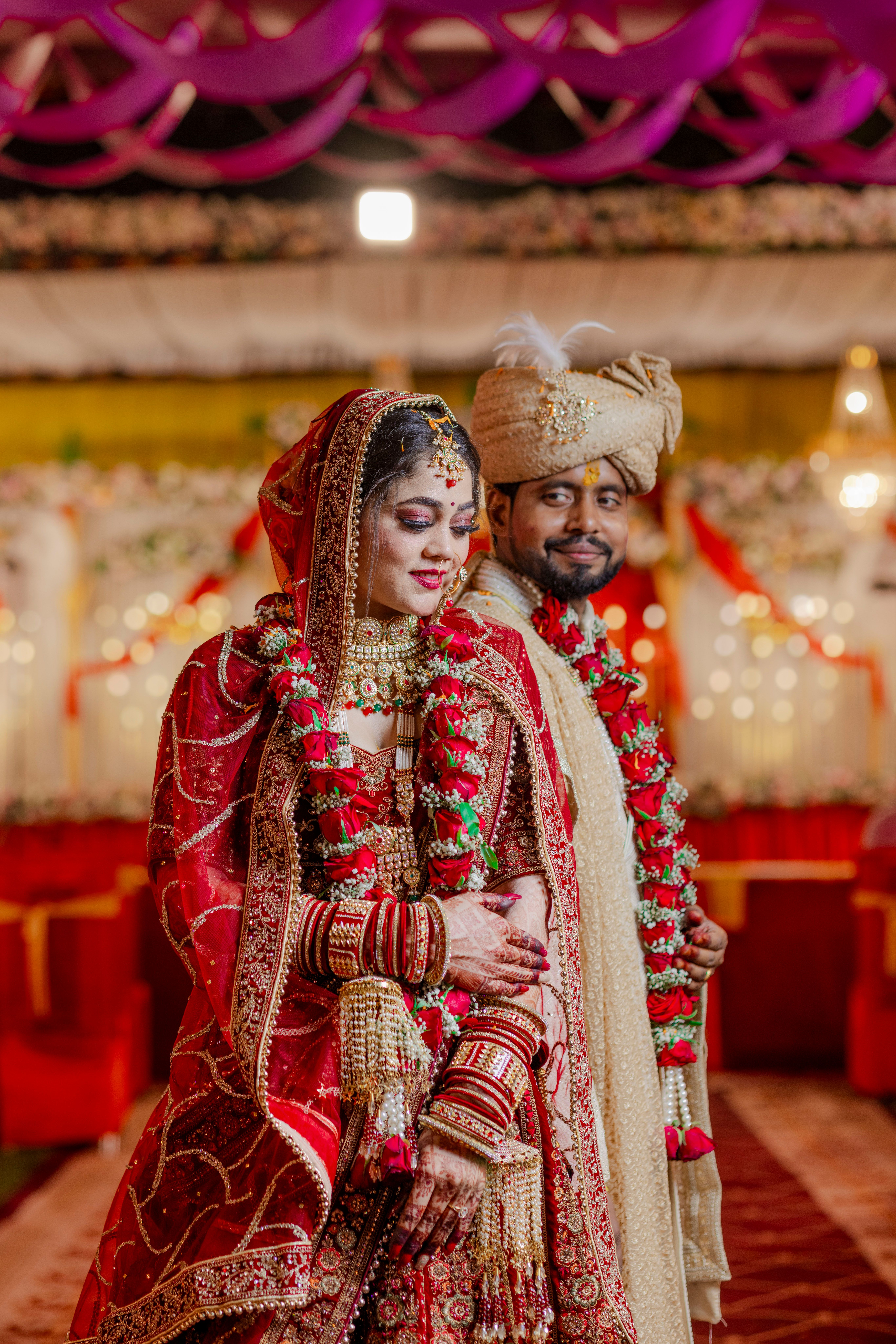Elegant capture of an Indian wedding couple in vibrant traditional attire, showcasing cultural beauty and heritage.