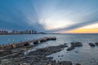 Stunning Coastal Sunset with City Skyline
