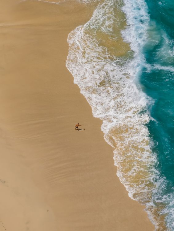 Aerial View of Surfer on Bali Beach · Free Stock Photo