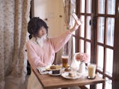 Woman Taking Selfie in Cozy Café Setting