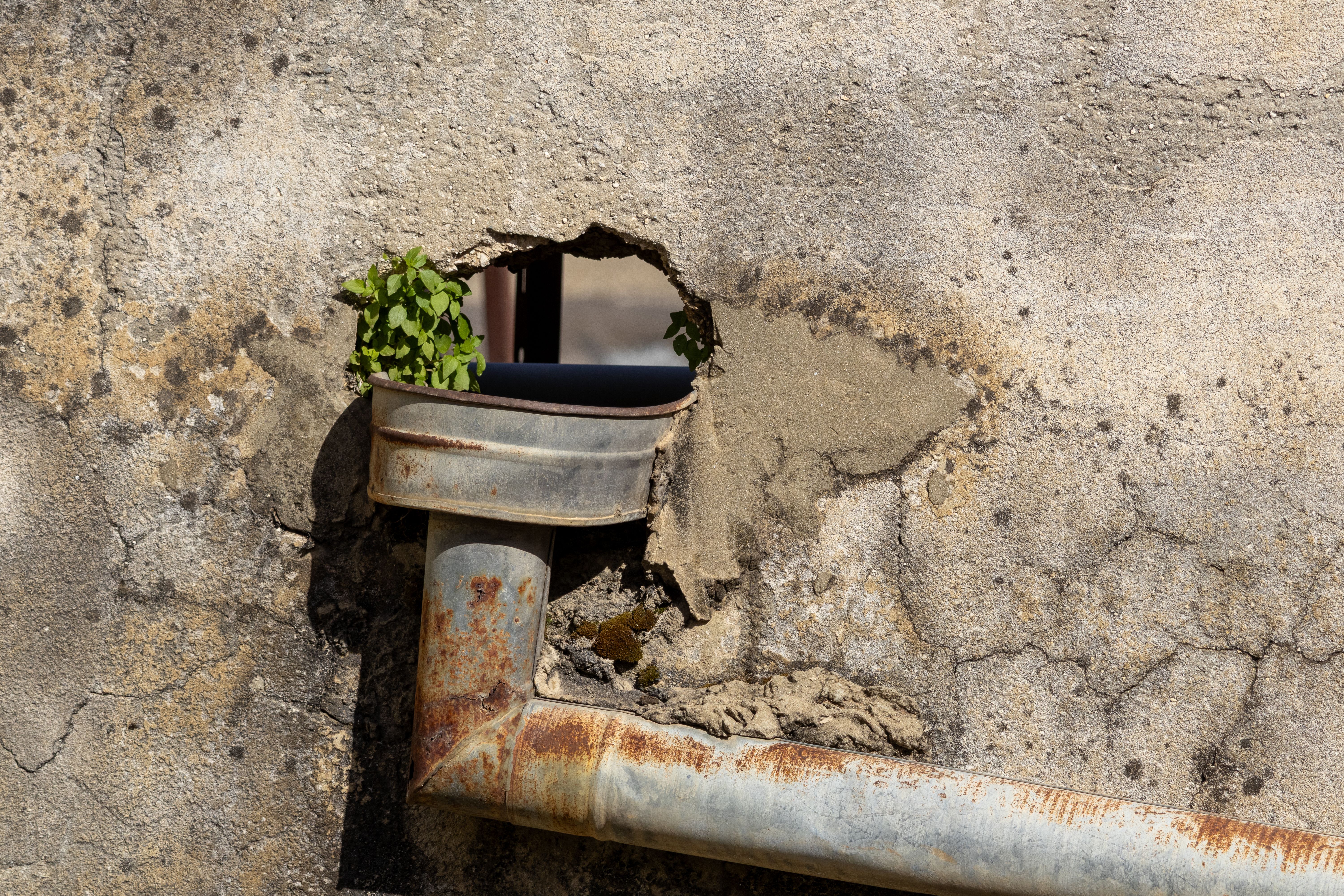 Foundation drainage system installation around a residential property in Dallas to prevent water damage and foundation i