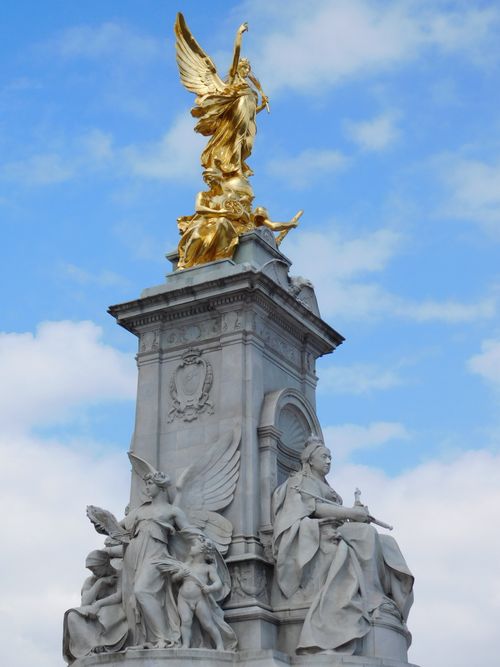 Free Close-up of the iconic Victoria Memorial statue in London, featuring golden and marble sculptures. Stock Photo