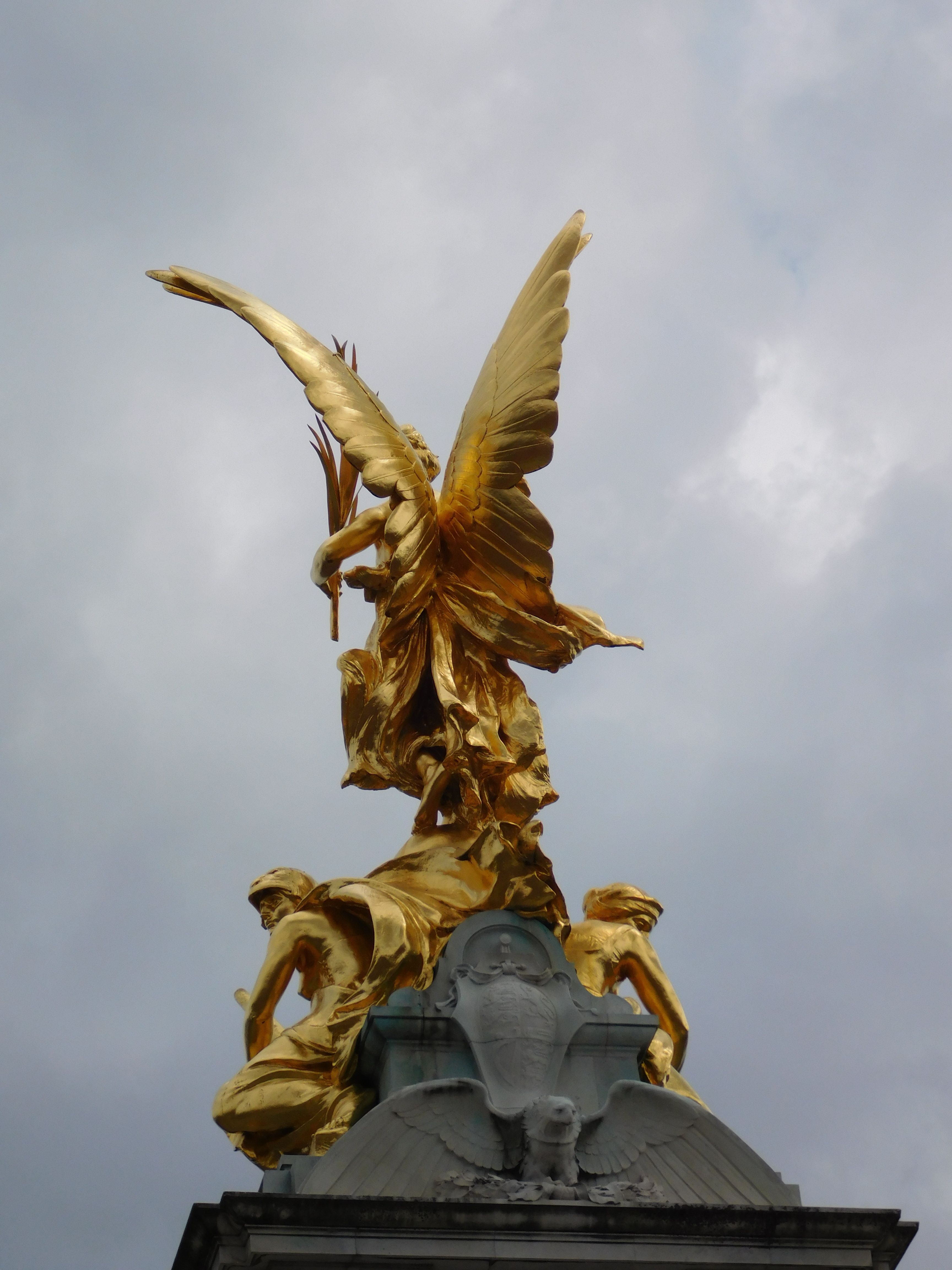 Gold Statue Under Blue Sky · Free Stock Photo