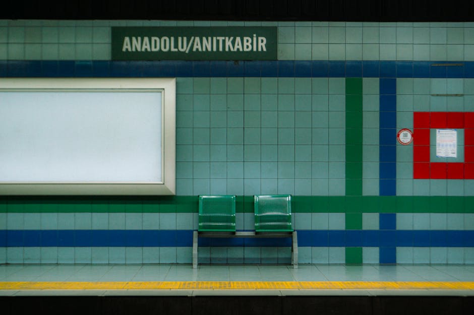 Calm metro station in Ankara, Türkiye with empty benches and colorful tiles.