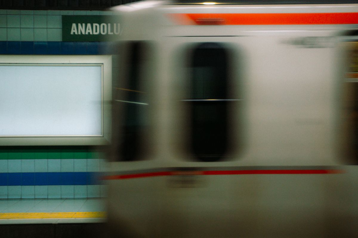 a high-speed blur of a subway train in a dark tunnel
