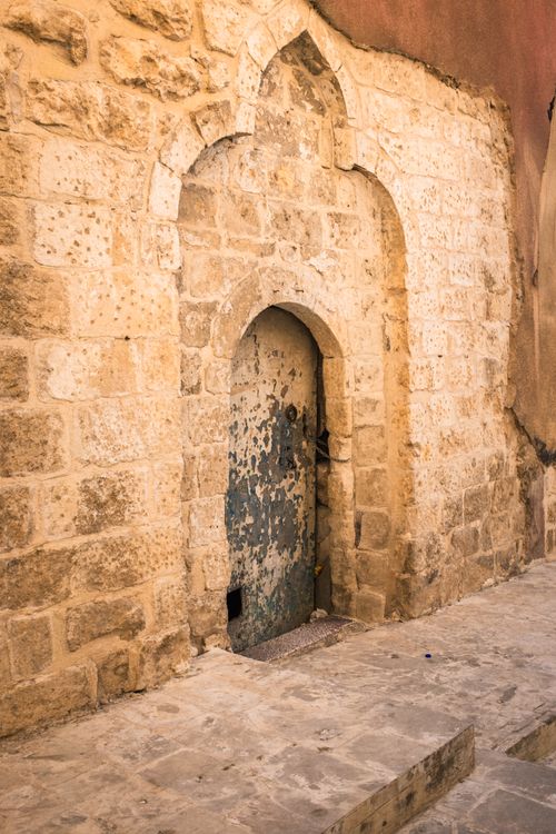 Free A vintage stone arch doorway with intricate design, showcasing historic architecture. Stock Photo