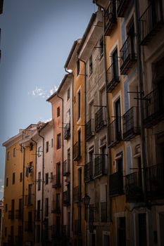 Charming street view of vibrant facades in Cuenca, capturing its architectural beauty.