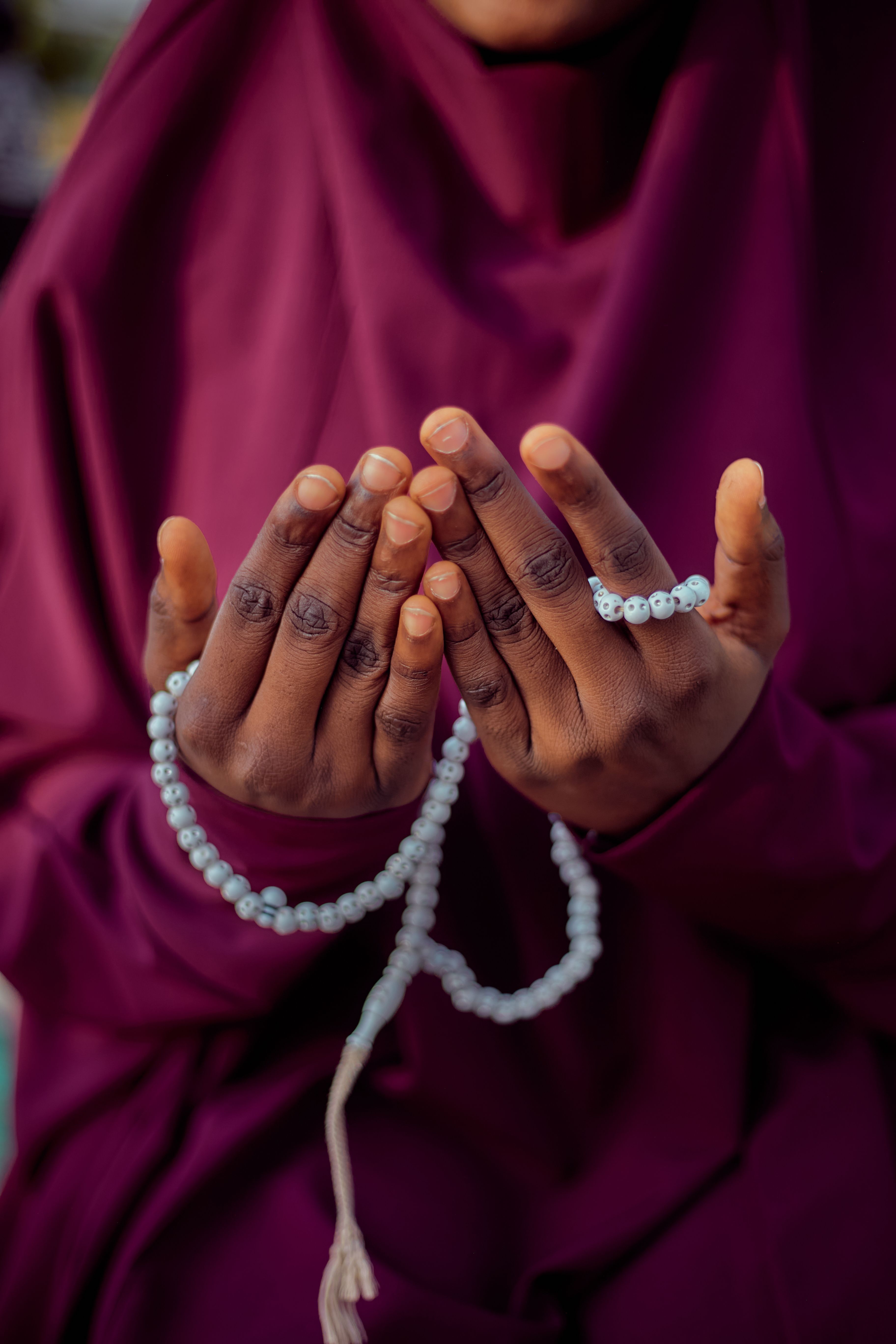 Hands Holding Prayer Beads in Spiritual Moment · Free Stock Photo
