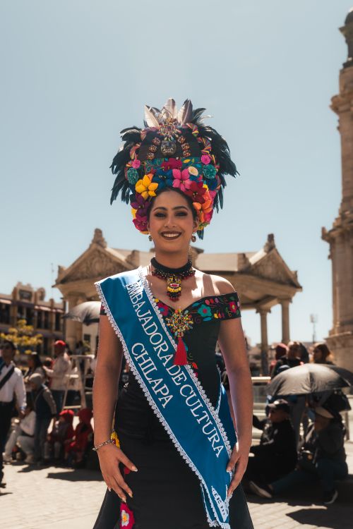 Free A vibrant cultural ambassador in traditional Mexican attire graces Pachuca de Soto. Stock Photo