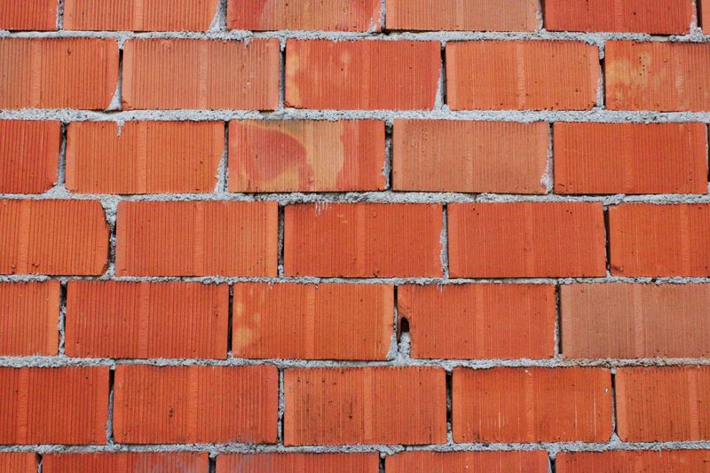 Lime-washed white brick wall