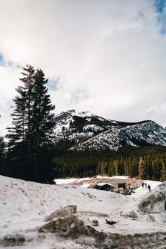 Explore the serene beauty of Banff with snow-capped mountains and lush forests in Alberta, Canada.