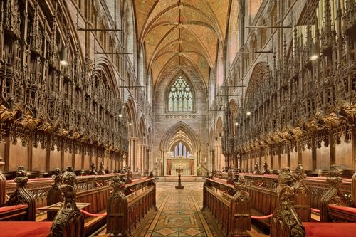Free Stunning interior view of Chester Cathedral showcasing gothic arches and intricate wood carvings. Stock Photo