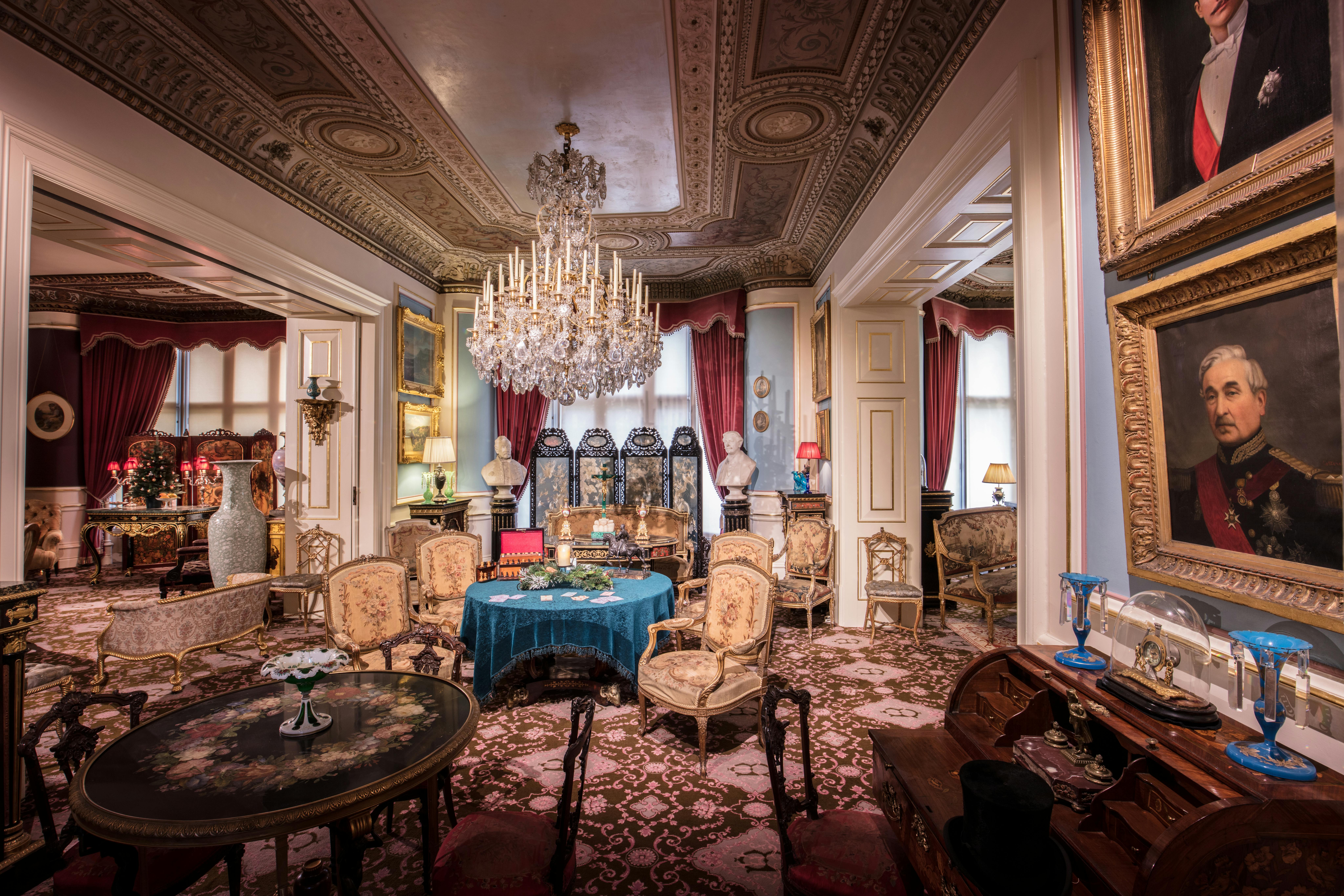 A beautifully decorated historic drawing room featuring opulent furnishing and architectural details.