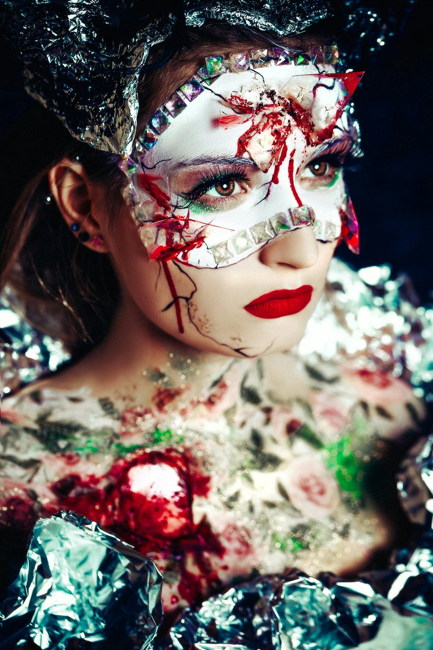 woman in white red and green floral dress with white and red face mask