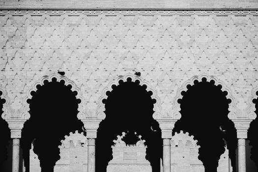 Captivating Moorish arches showcasing detailed patterns in monochrome.