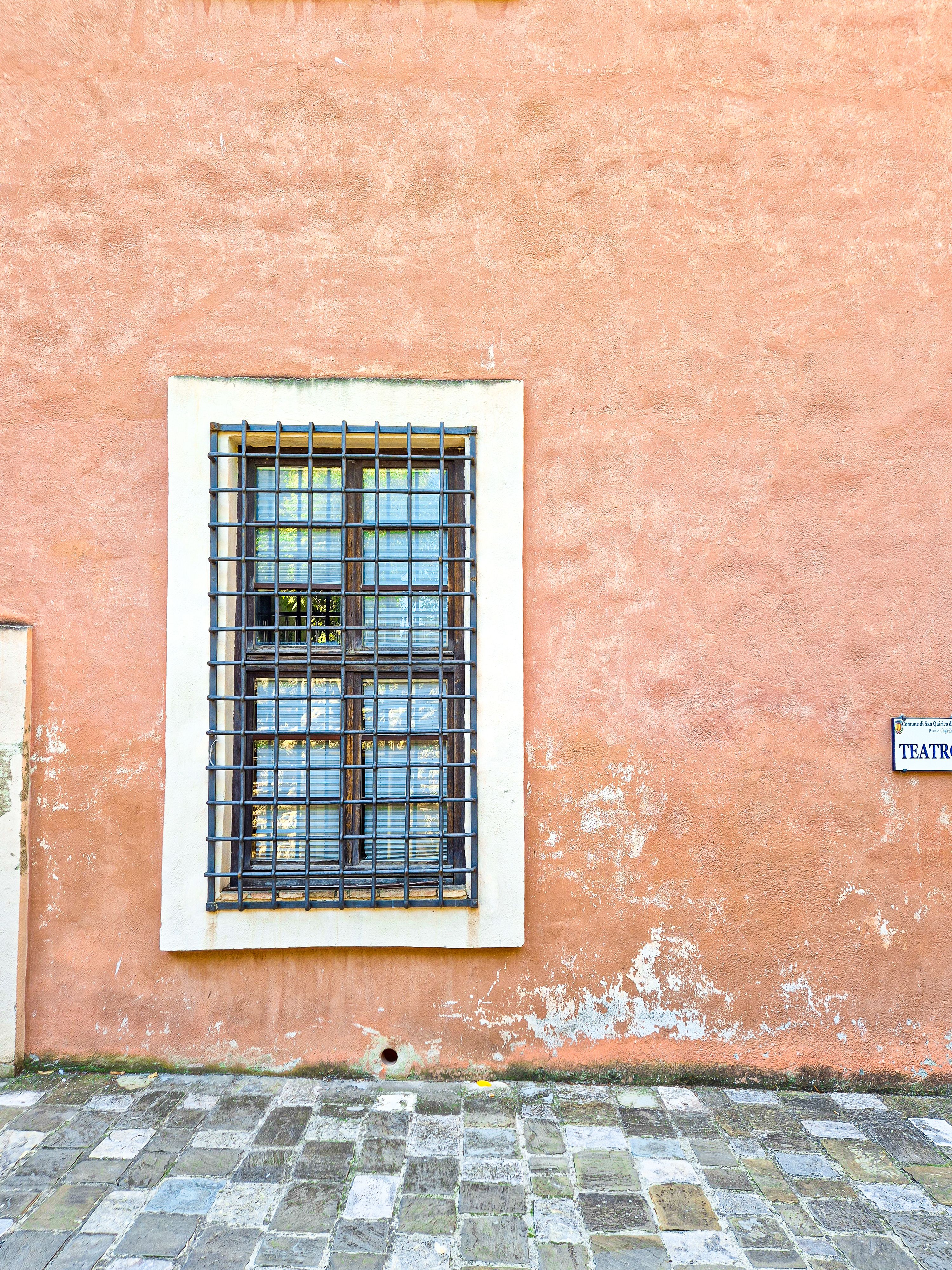 Old Building Window with Iron Bars on Rustic Wall · Free Stock Photo