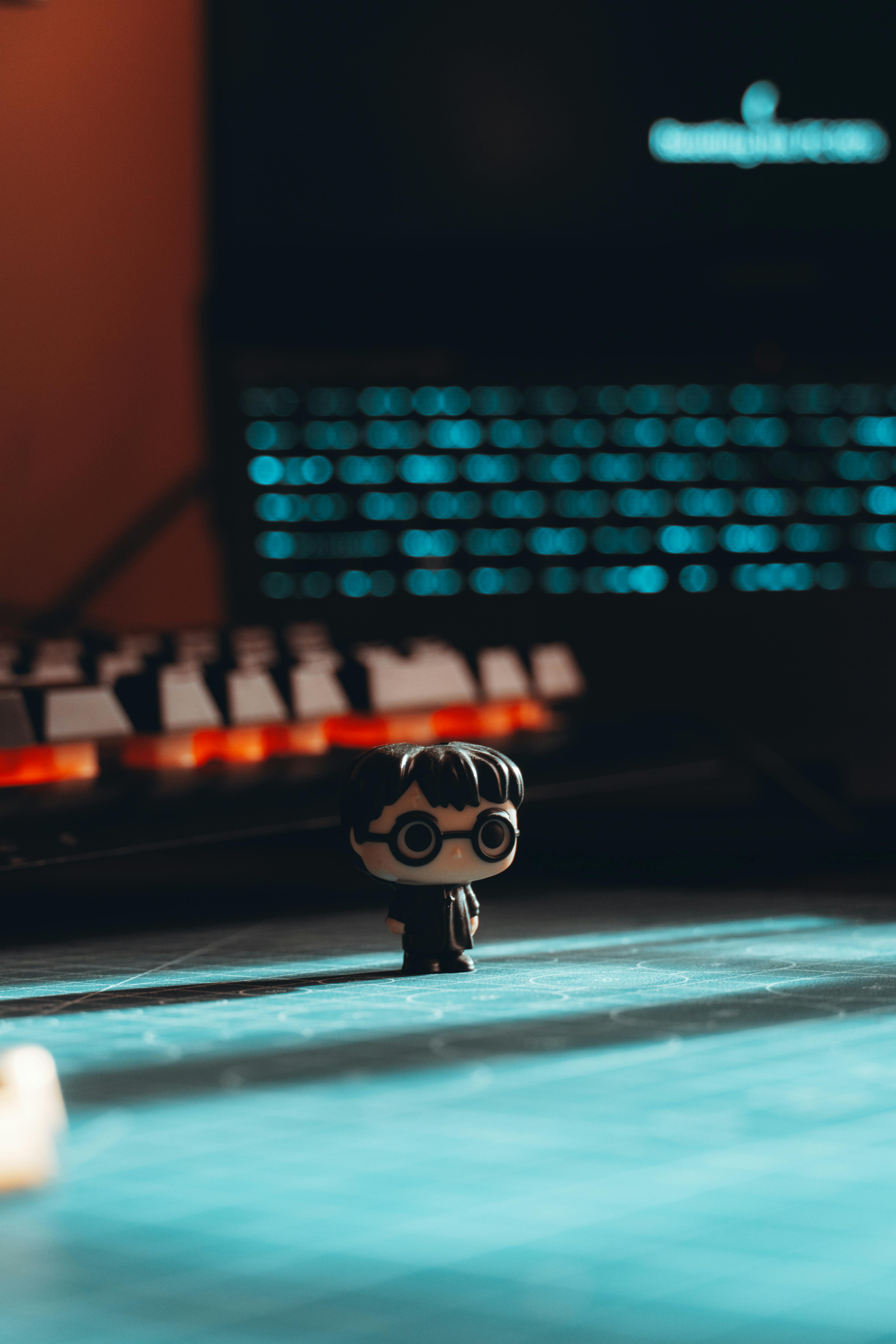 Free Minimalist desktop featuring a small action figure, perfect for creative desk decor enthusiasts. Stock Photo