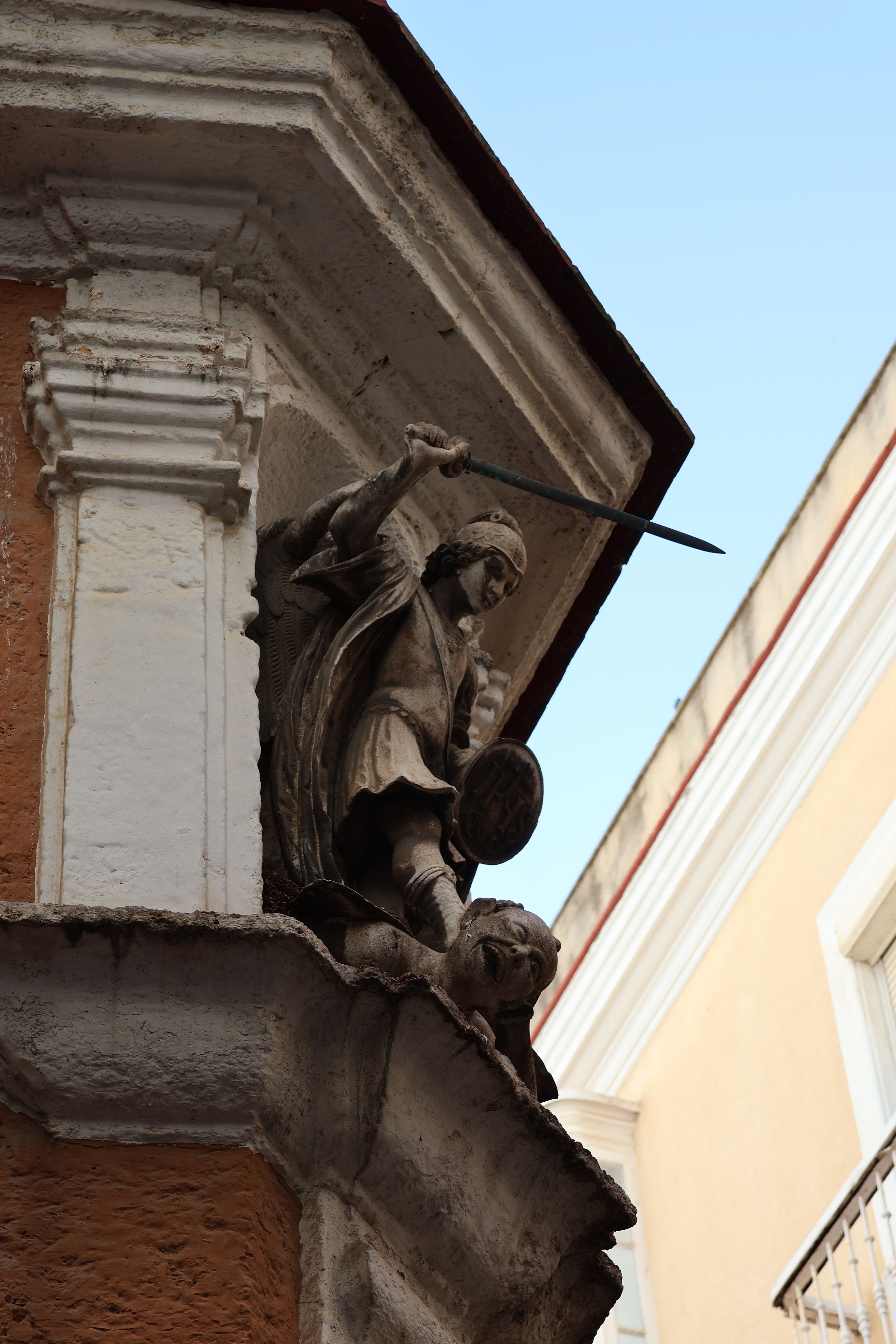 Statue of Archangel Michael with sword on a Cádiz building corner, Andalucía, Spain.