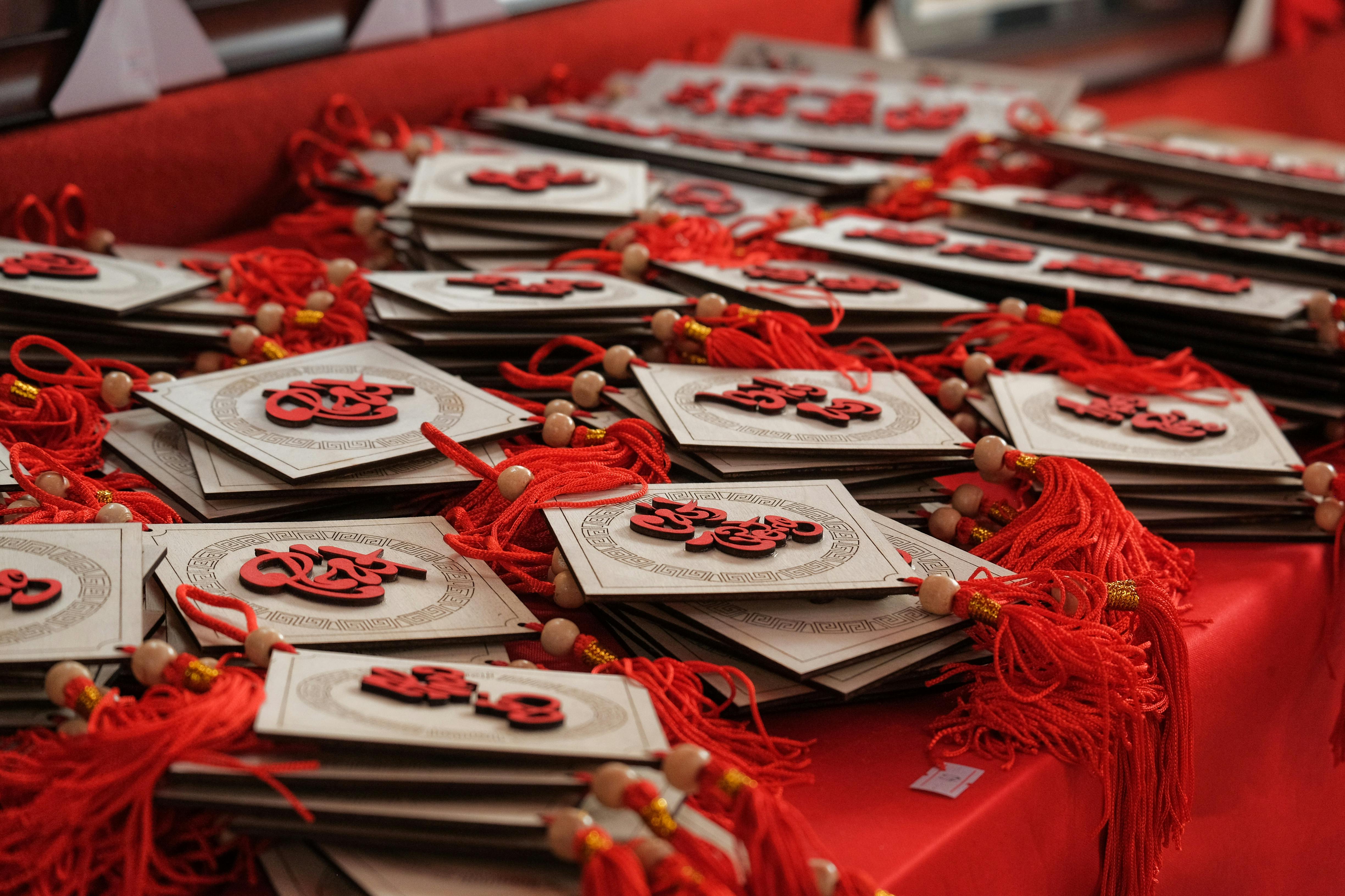 white and red lucky charm on red table