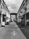 Urban Alleyway with Industrial Buildings Black and White