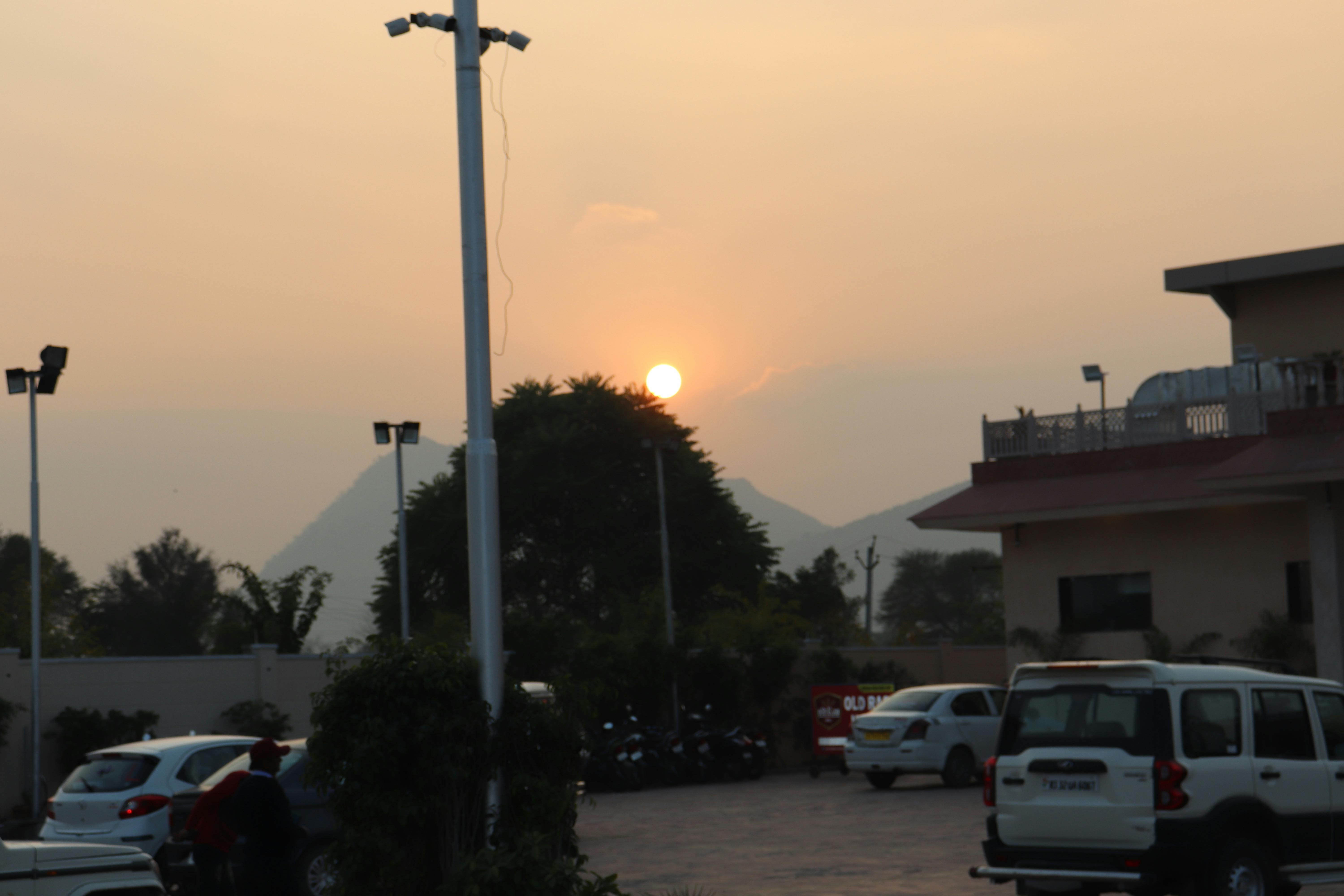Fashion model wearing all-white outfit on a minimalist background