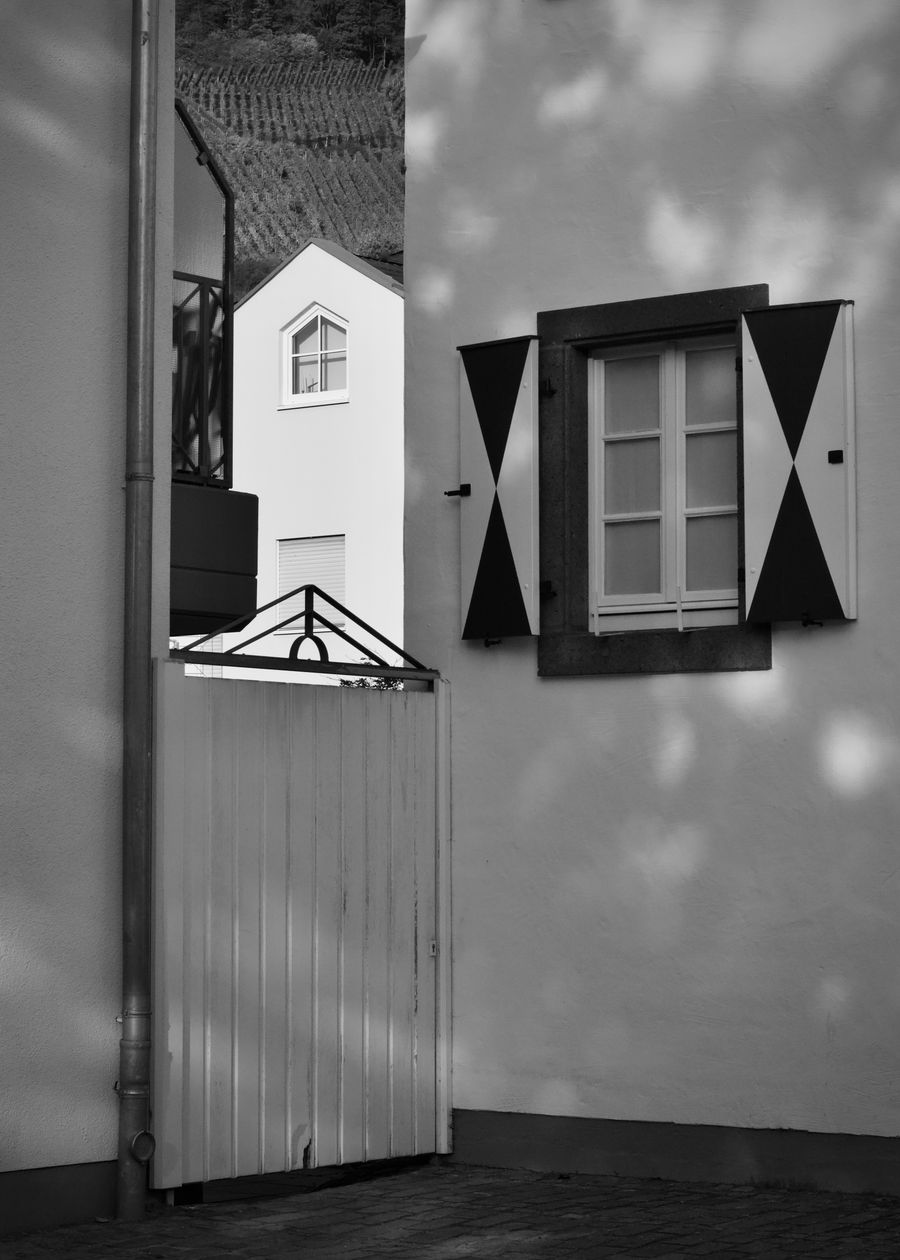 Black and white facade detail with shadows and graphic composition