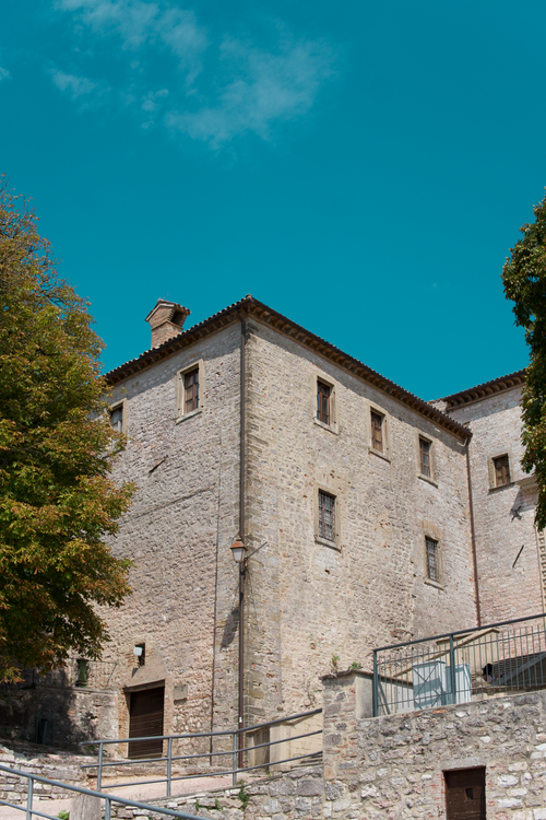 Free A historic stone building in Perugia under a clear blue sky, showcasing classic Italian architecture. Stock Photo