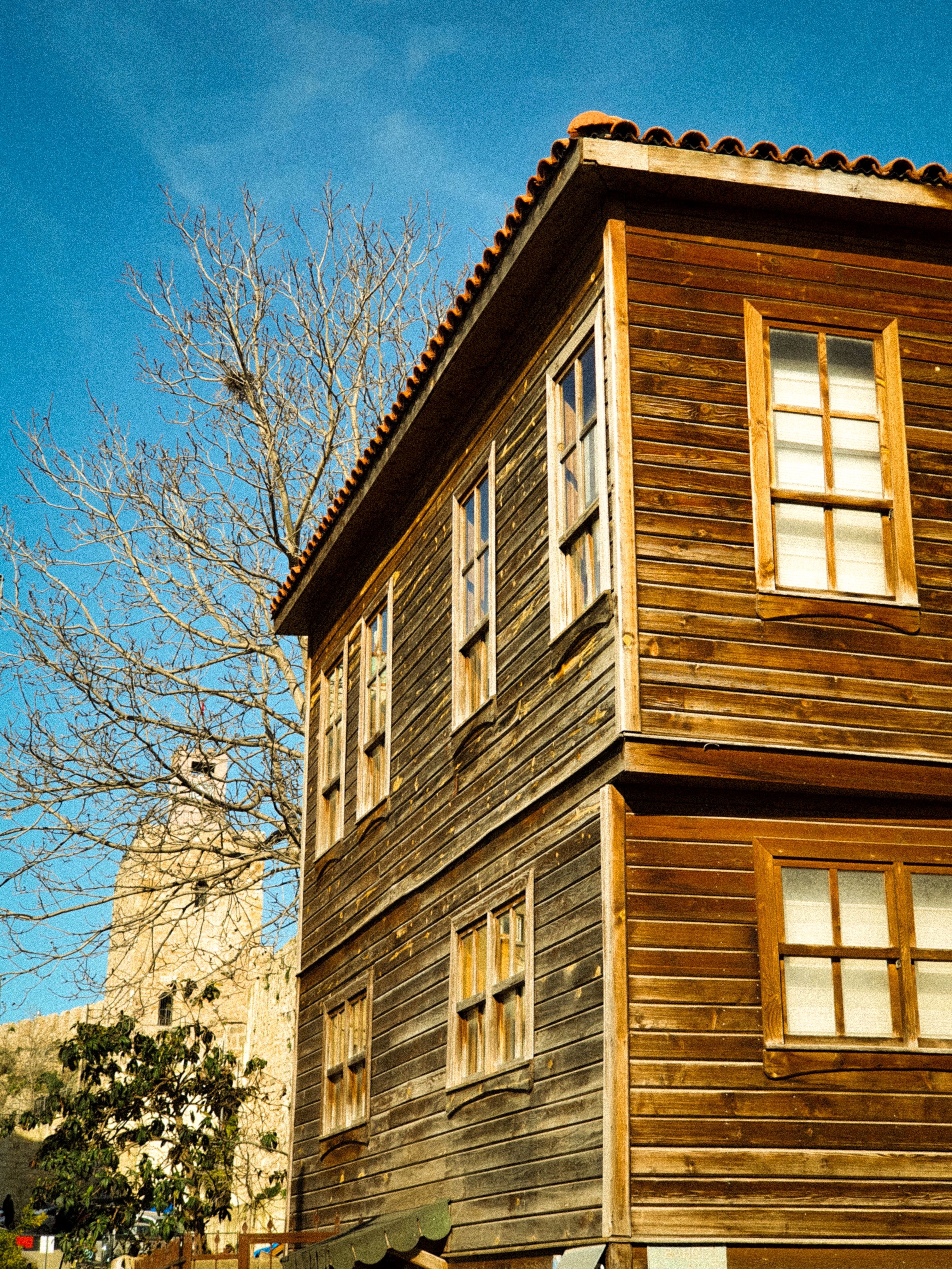 Traditional Wooden House with Clear Blue Sky · Free Stock Photo