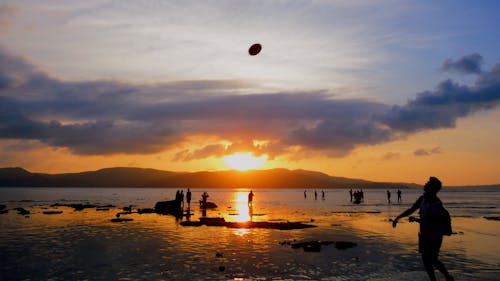 People on Water during Golden Hour