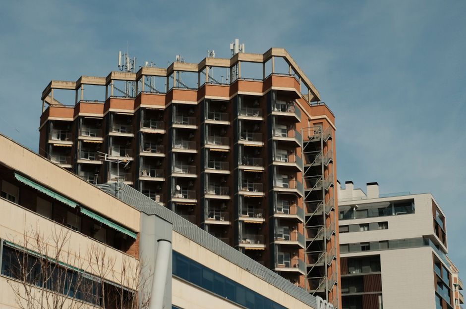 High-rise buildings with geometric designs in Zaragoza, Spain under a clear sky.