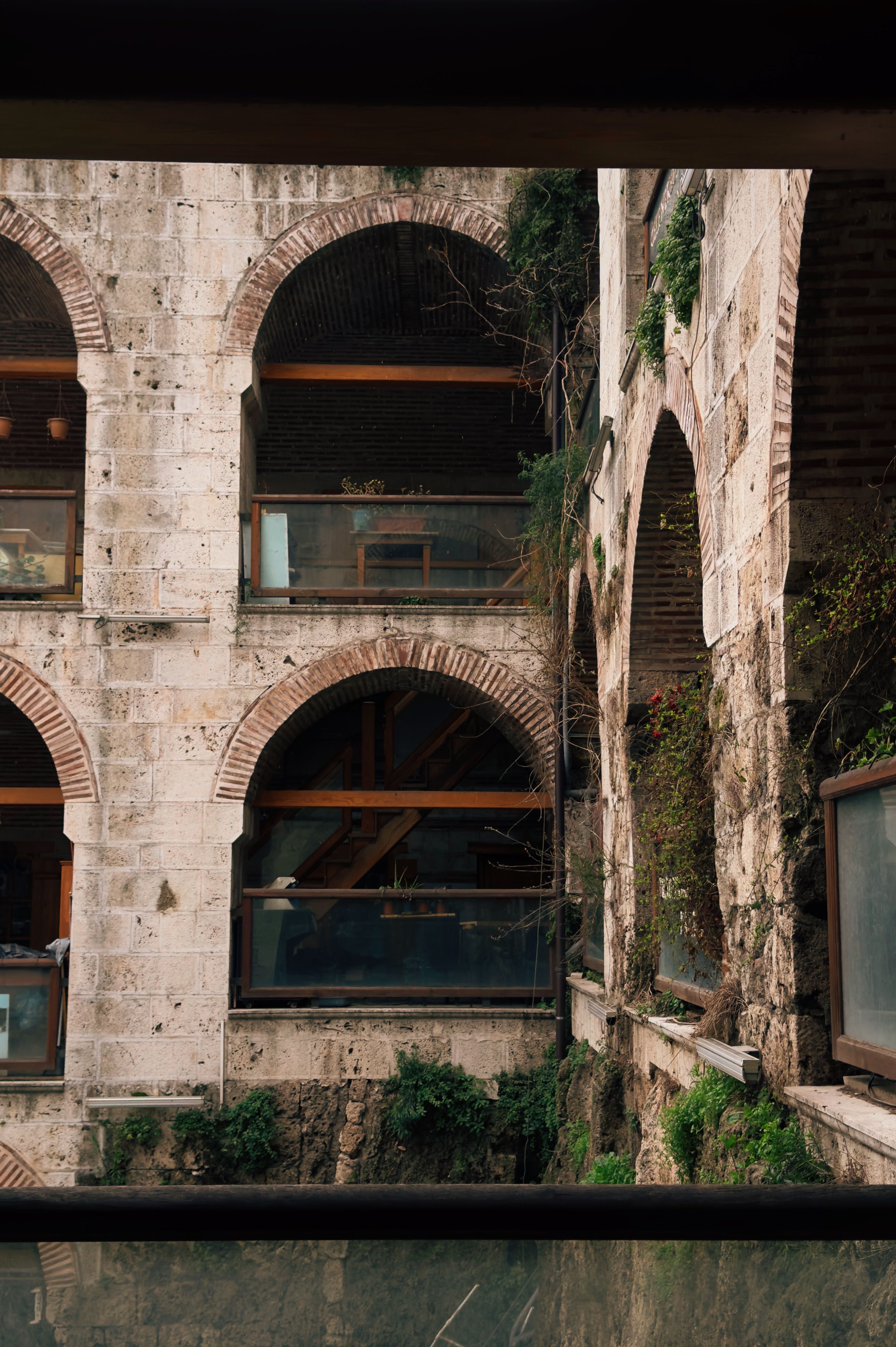 Historic Arched Architecture with Greenery · Free Stock Photo