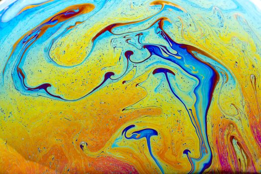 A vivid abstract pattern with swirling colors creates a fluid, psychedelic design.