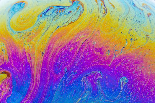 A vivid blend of colors creating a dynamic fluid pattern, perfect for artistic backgrounds.