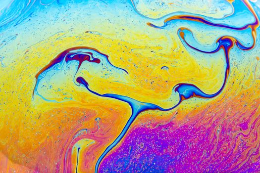 Vibrant abstract art with swirling fluid patterns in bright colors, creating a psychedelic texture.