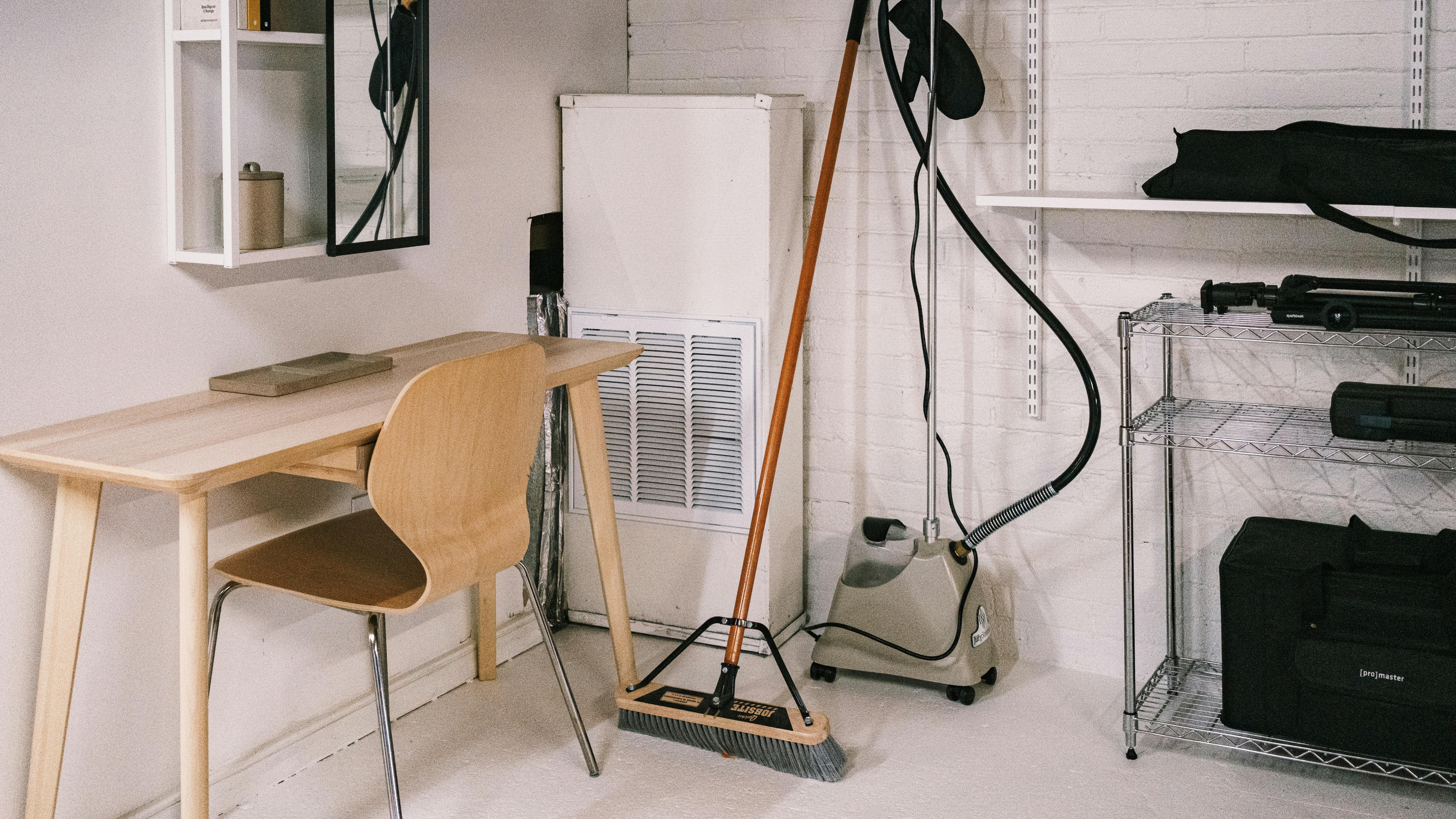 Wall rack for 1BHK providing compact organized storage, minimalist decor, and efficient use of wall space