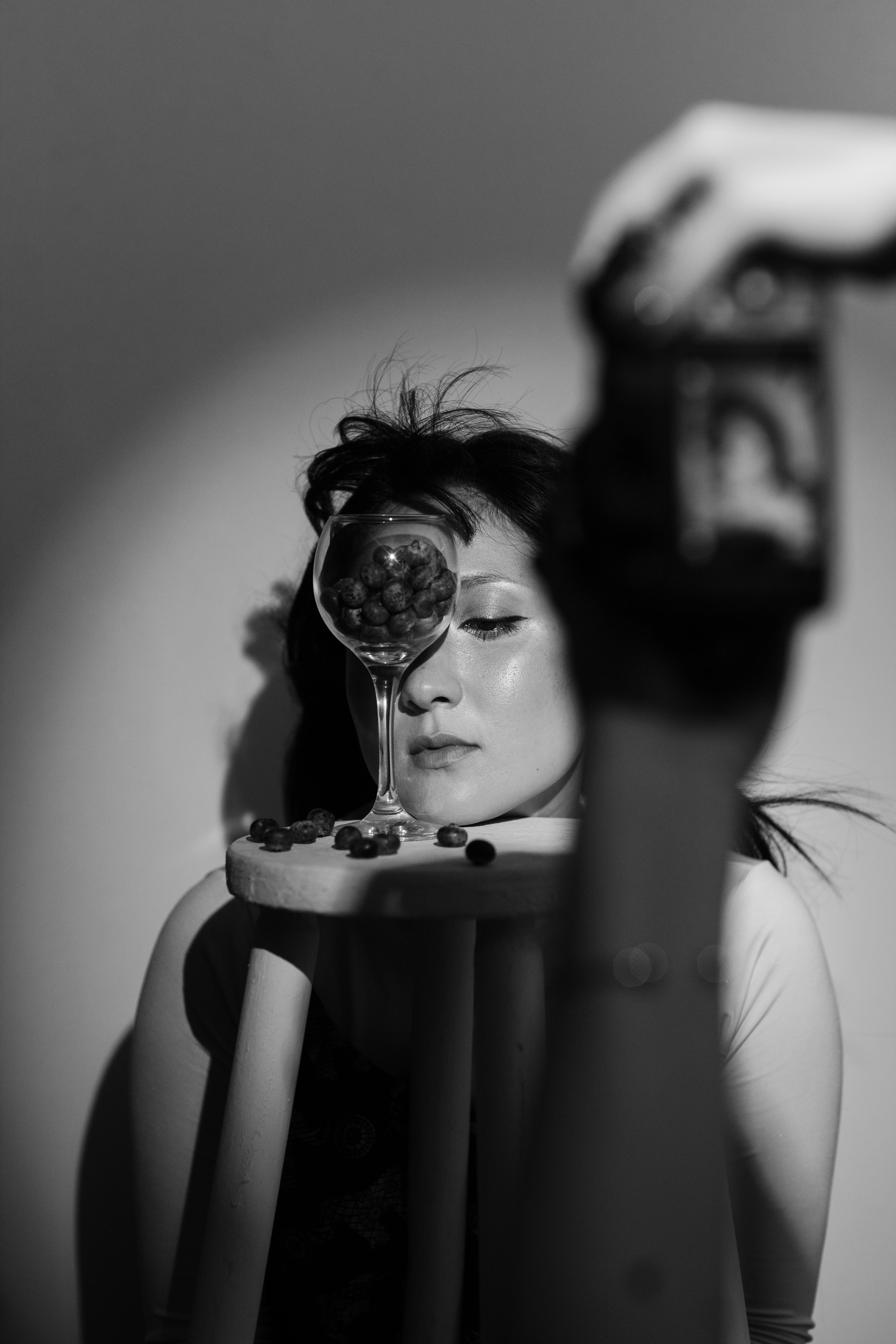 Free A creative black and white portrait with glass reflections adding a conceptual touch. Stock Photo