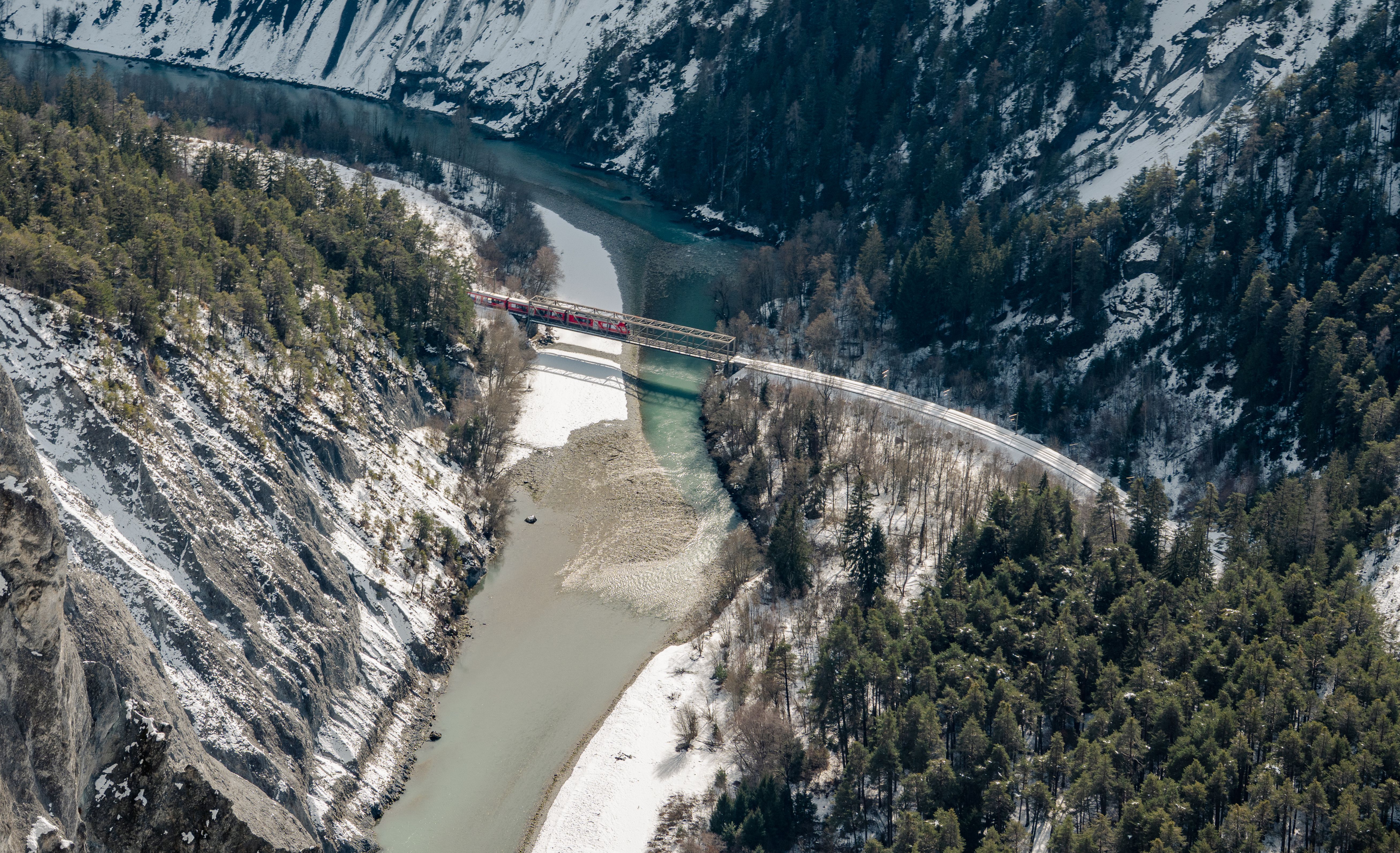 Aerial View of Snowy River and Bridge in Winter · Free Stock Photo