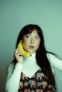 Creative Portrait of a Woman with Banana Phone