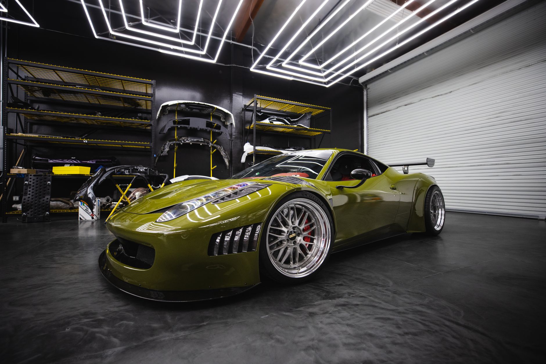 Sports car with corrected glossy paint in a workshop