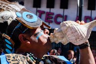 Traditional Mexican Festival Performer Blowing Conch