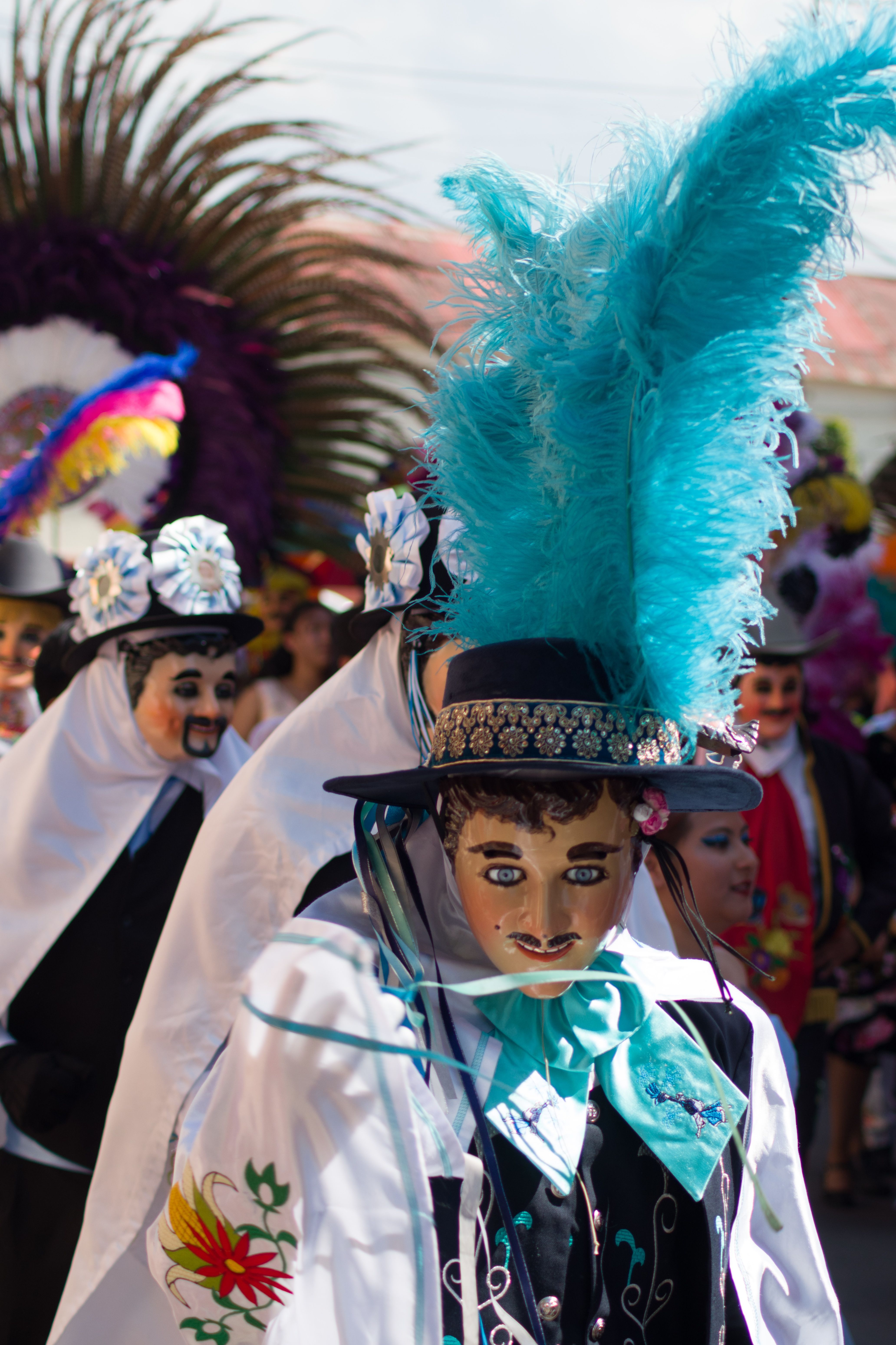 Colorful costumes and masks at the Tlaxcala carnival celebration.