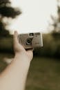Person Holding Vintage Excel-1 Camera Outdoors