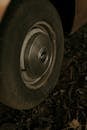 Close-up of Vintage Car Wheel on Leafy Ground