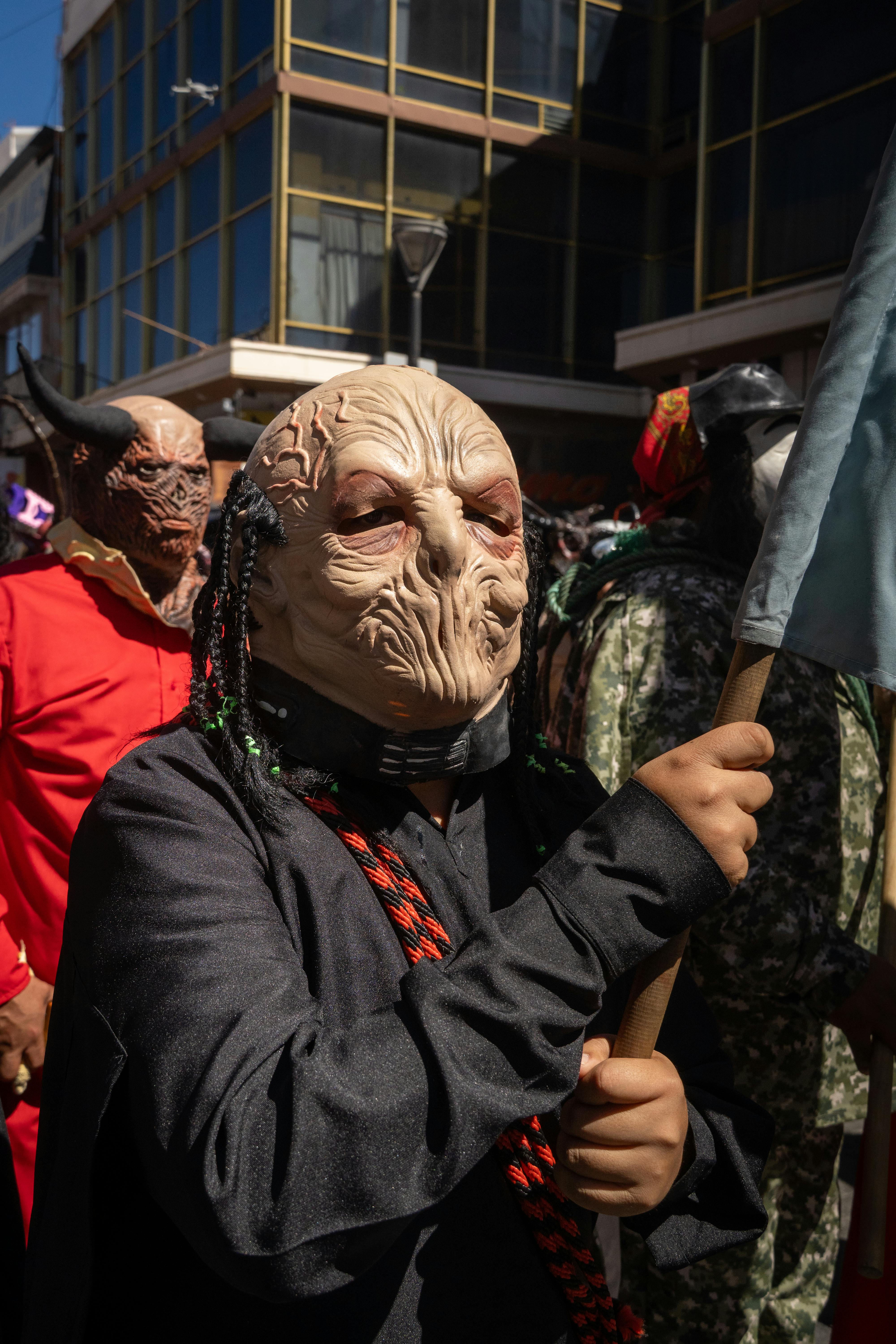 Festival scene at a carnival in Pachuca, Mexico, showcasing vibrant costumes and cultural expressions.