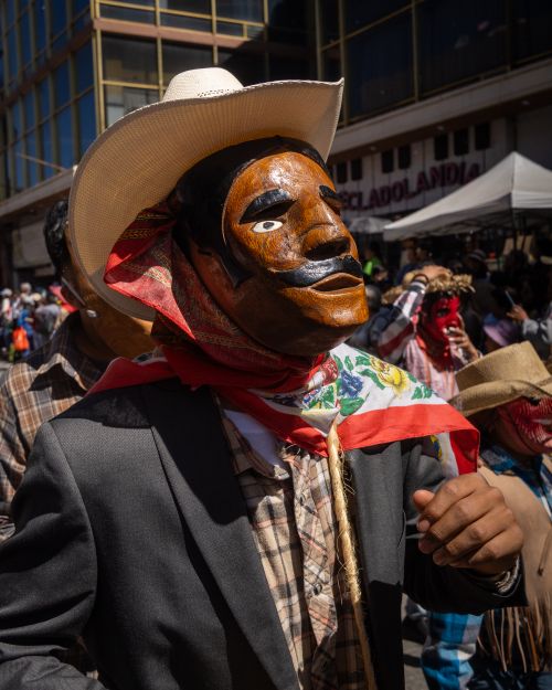 Free Colorful scene from a Mexican carnival in Pachuca featuring traditional masks and costumes. Stock Photo