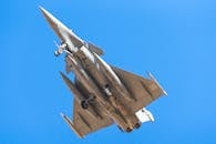 Rafale Fighter Jet in Flight Against Blue Sky