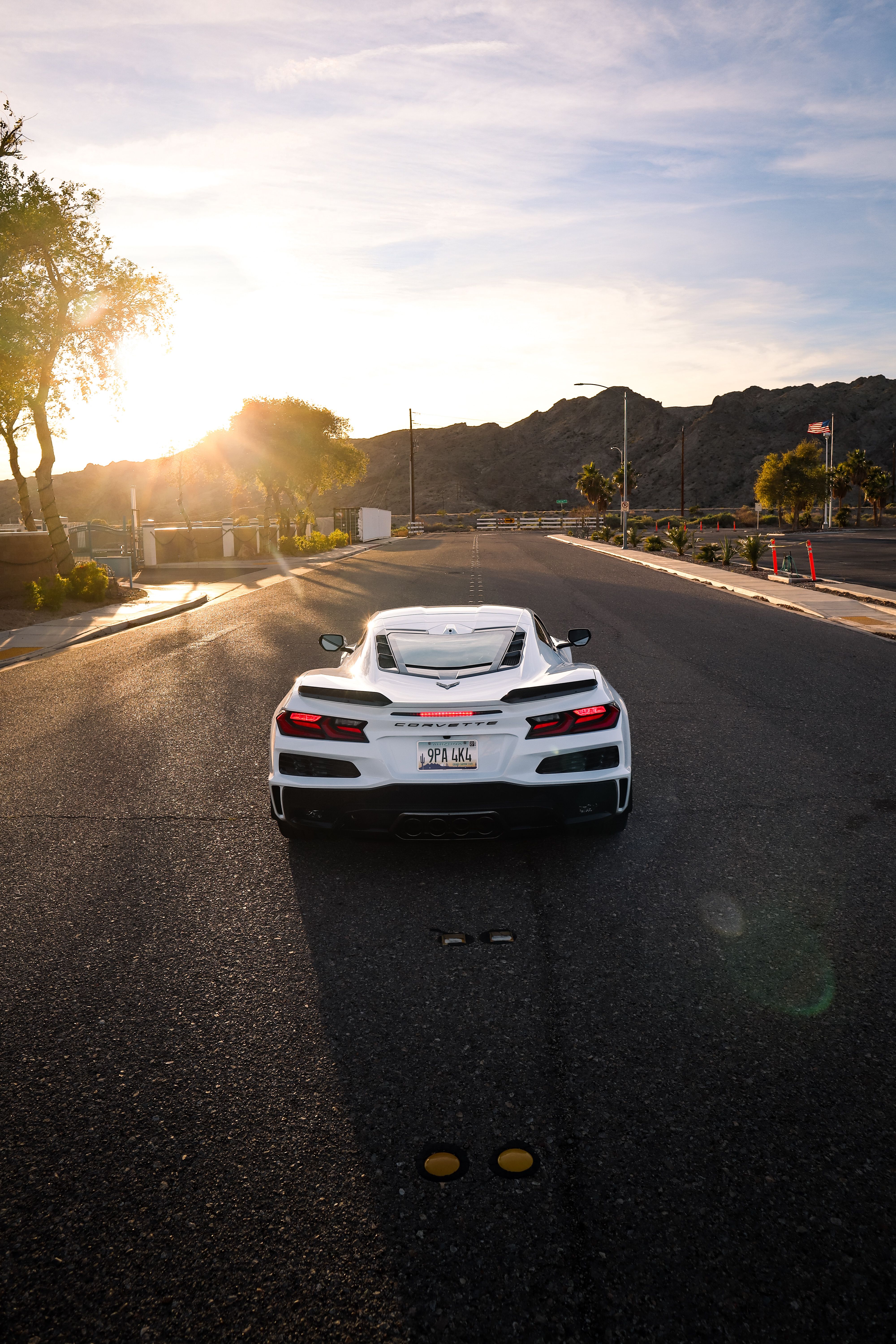 White Sports Car on Desert Highway at Sunset · Free Stock Photo